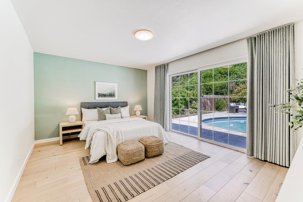 1349 Murchison Drive Millbrae, CA 94030 - Photo 48 of 66 a bedroom with a large bed and a large window