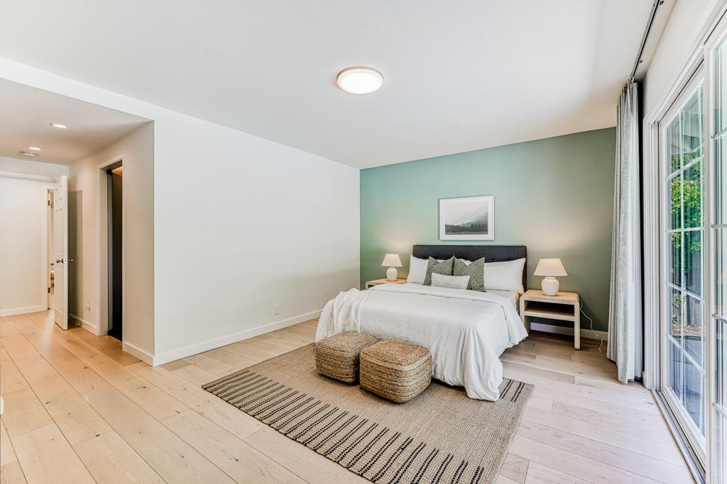 1349 Murchison Drive Millbrae, CA 94030 - Photo 49 of 66 a bedroom with a bed and a night stand