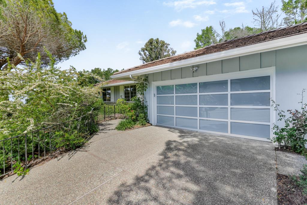 1349 Murchison Drive Millbrae, CA 94030 - Photo 57 of 66 a view of a house with a yard and garage