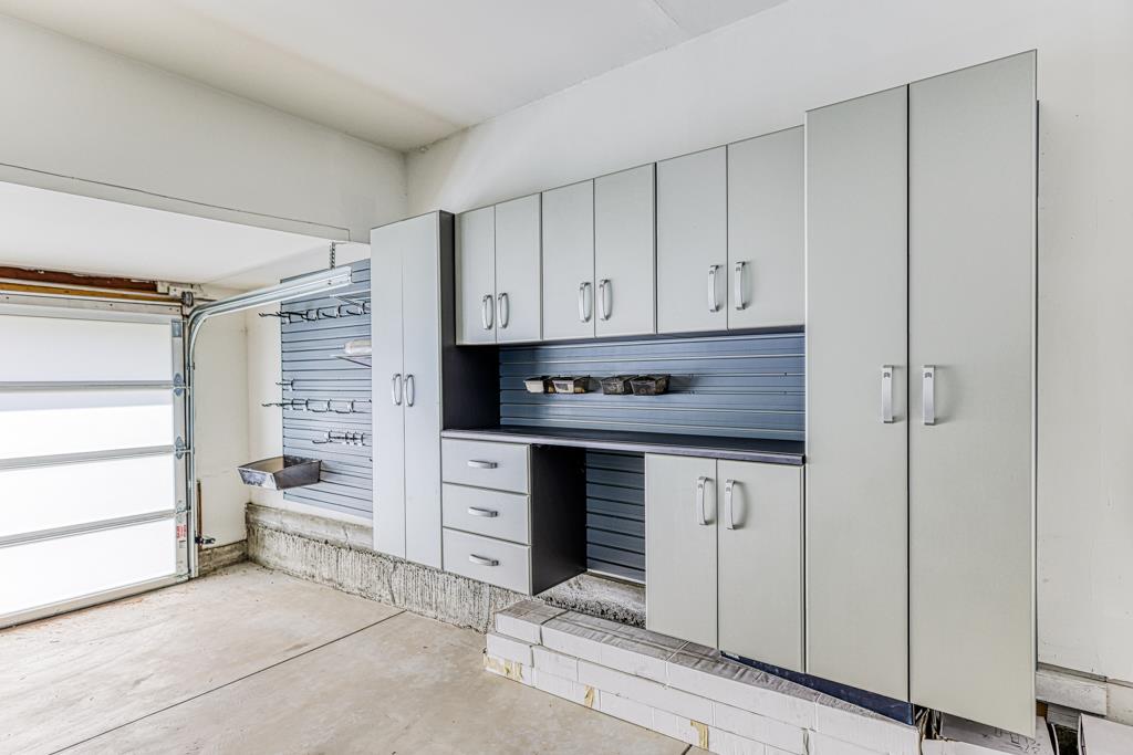 1349 Murchison Drive Millbrae, CA 94030 - Photo 65 of 66 a kitchen with white cabinets and white appliances