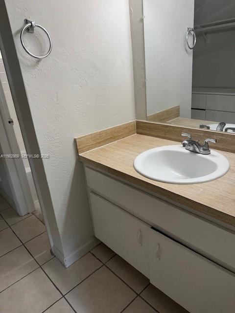 8601 Southwest 68th Court, Unit 23 Pinecrest, FL 33156 - Photo 5 of 9 a bathroom with a sink and a mirror