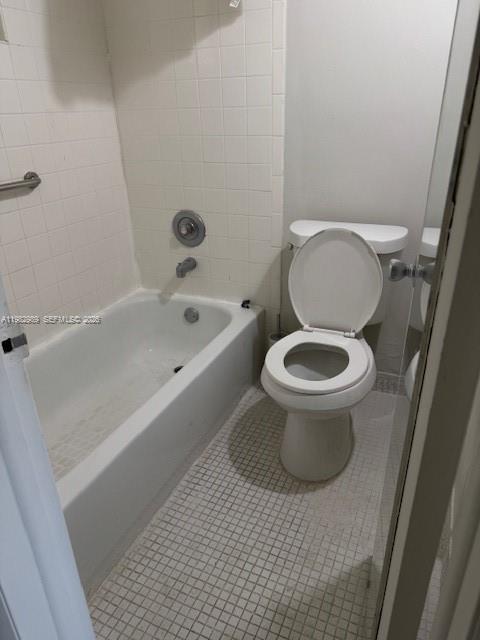 8601 Southwest 68th Court, Unit 23 Pinecrest, FL 33156 - Photo 6 of 9 a white toilet sitting next to a bath tub