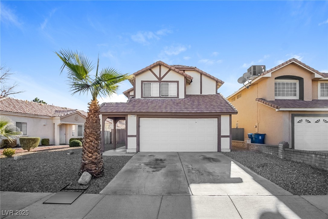 7118 Shadow Crest Drive Las Vegas, NV 89119 - Photo 1 of 15 English style home with central AC unit, concrete