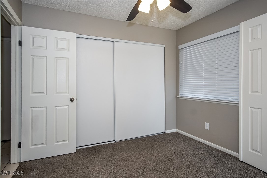 7118 Shadow Crest Drive Las Vegas, NV 89119 - Photo 11 of 15 Unfurnished bedroom featuring carpet, baseboards,