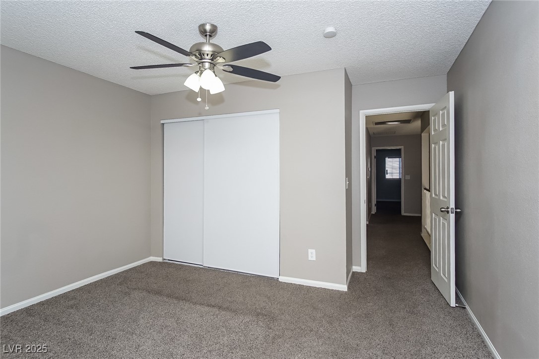 7118 Shadow Crest Drive Las Vegas, NV 89119 - Photo 12 of 15 Unfurnished bedroom with a closet, carpet flooring