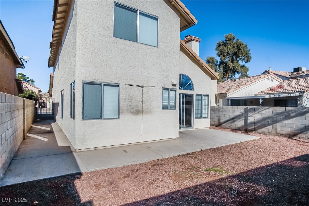 7118 Shadow Crest Drive Las Vegas, NV 89119 - Photo 15 of 15 Back of property featuring stucco siding, a fenced