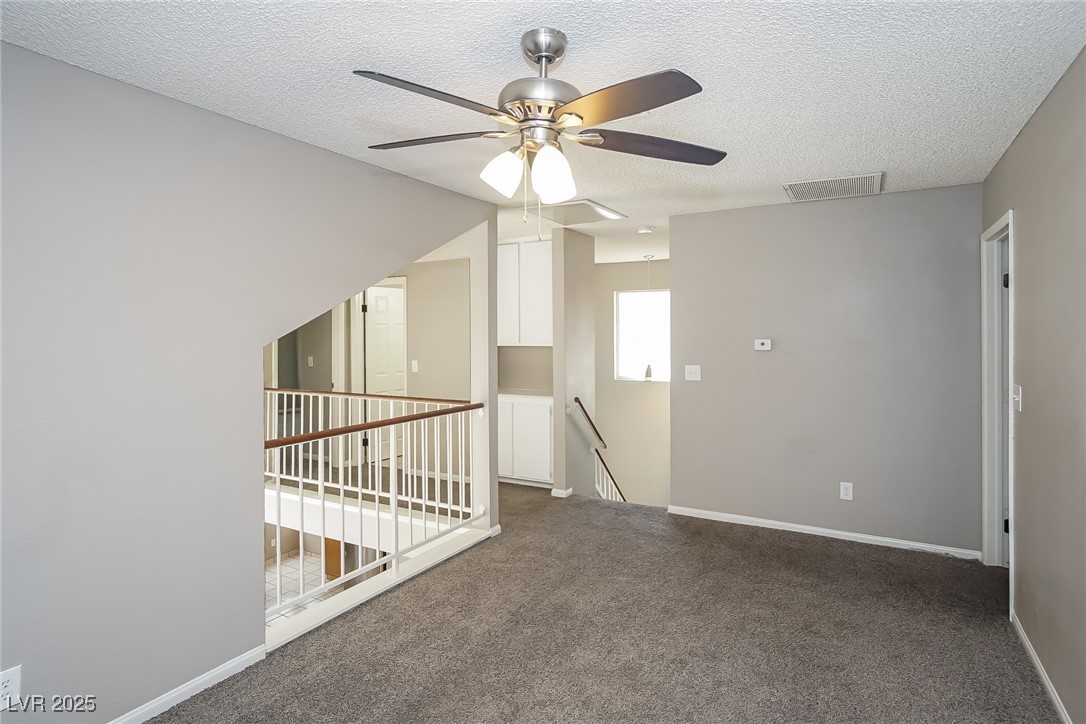 7118 Shadow Crest Drive Las Vegas, NV 89119 - Photo 7 of 15 Unfurnished room with a textured ceiling, visible