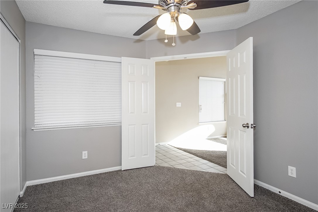7118 Shadow Crest Drive Las Vegas, NV 89119 - Photo 10 of 15 Unfurnished bedroom featuring carpet, baseboards,