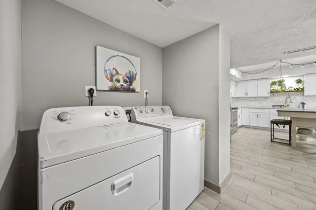 a view of storage and utility room with washer and dryer