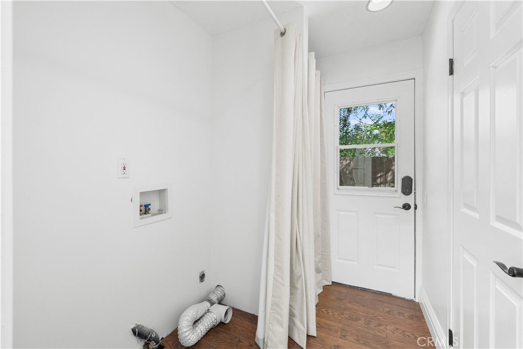26096 Adamor Road Calabasas, CA 91302 - Photo 28 of 61 Utility room with gas & 220 volt power for washer and drier hookups. Whole house fan is in the ceiling and door leads to large side yard.