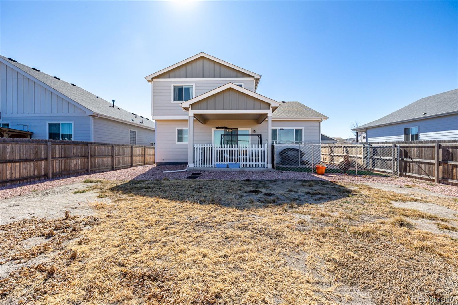 1875 Rancher Drive Milliken, CO 80543 - Photo 34 of 50 a front view of a house with a yard