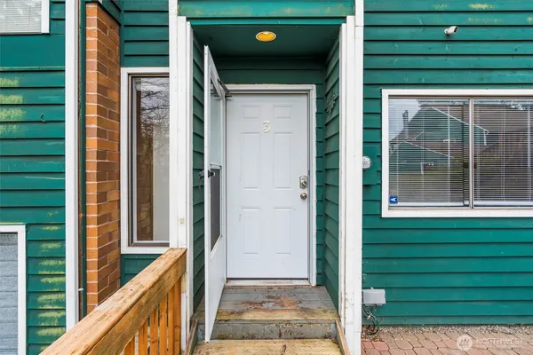a view of a door and a window