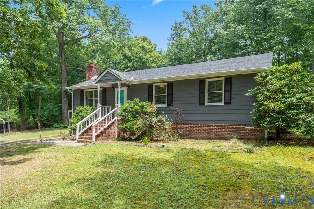 16203 Rowlett Road Chesterfield, VA 23838 - Photo 5 of 35 Ranch-style exterior featuring gray siding, a bric
