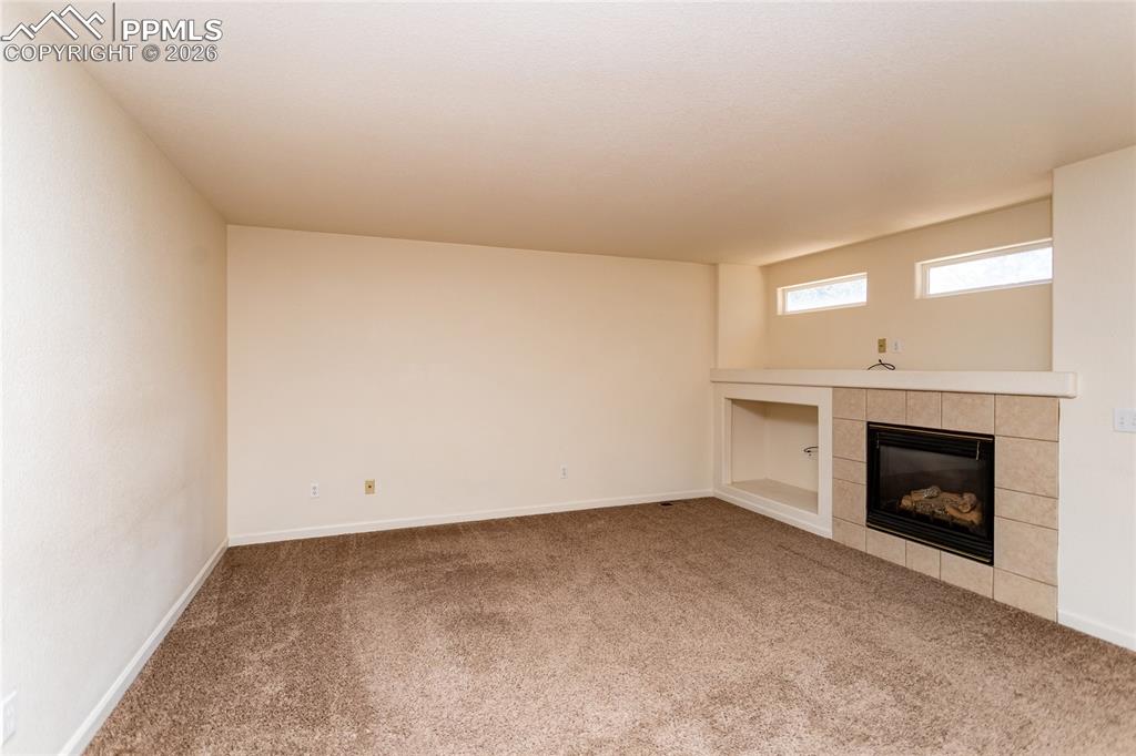 414 West Cheyenne Road Colorado Springs, CO 80906 - Photo 11 of 45 a view of empty room with a fireplace