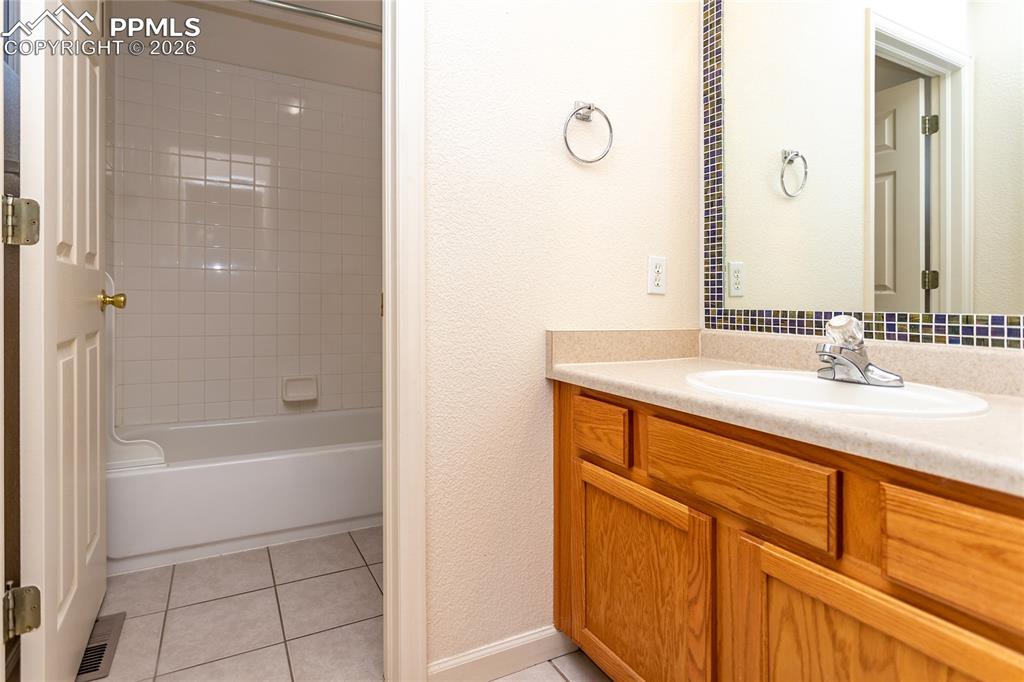 414 West Cheyenne Road Colorado Springs, CO 80906 - Photo 23 of 45 a bathroom with a sink and a bathtub
