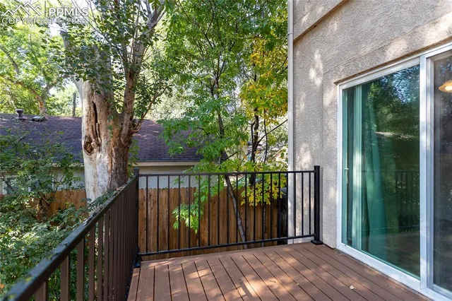 a view of balcony with wooden floor