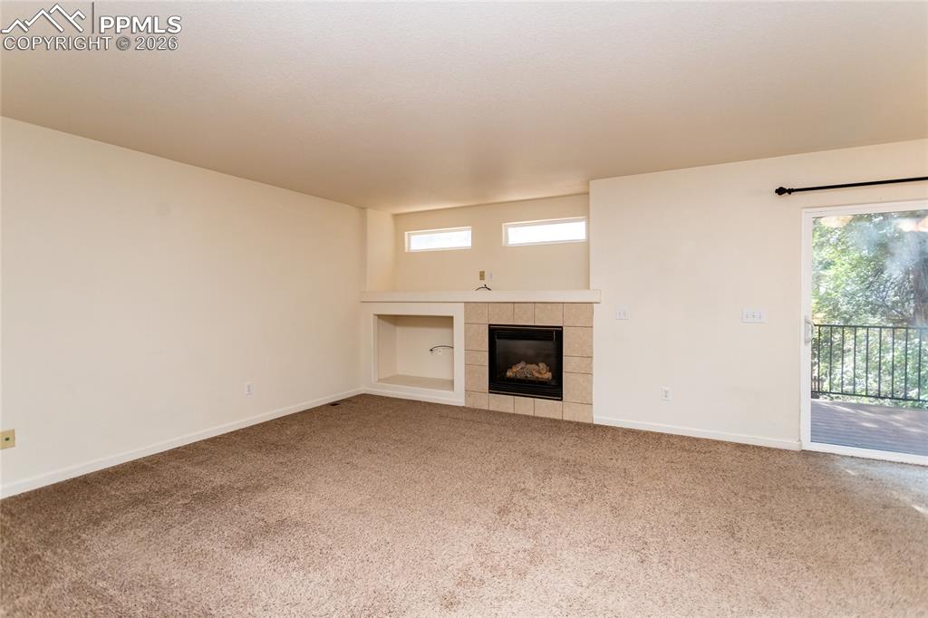 414 West Cheyenne Road Colorado Springs, CO 80906 - Photo 10 of 45 an empty room with fireplace