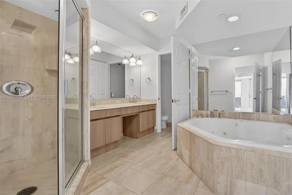 a bathroom with a glass door shower