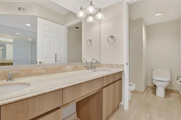 a view of an empty room with closet area