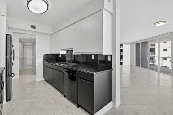 a view of a garden with a building