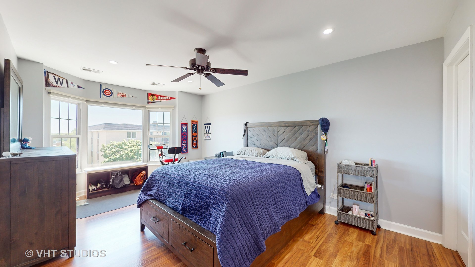 8630 Waukegan Road, Unit 519 Morton Grove, IL 60053 - Photo 15 of 26 a spacious bedroom with a bed and a wooden floor