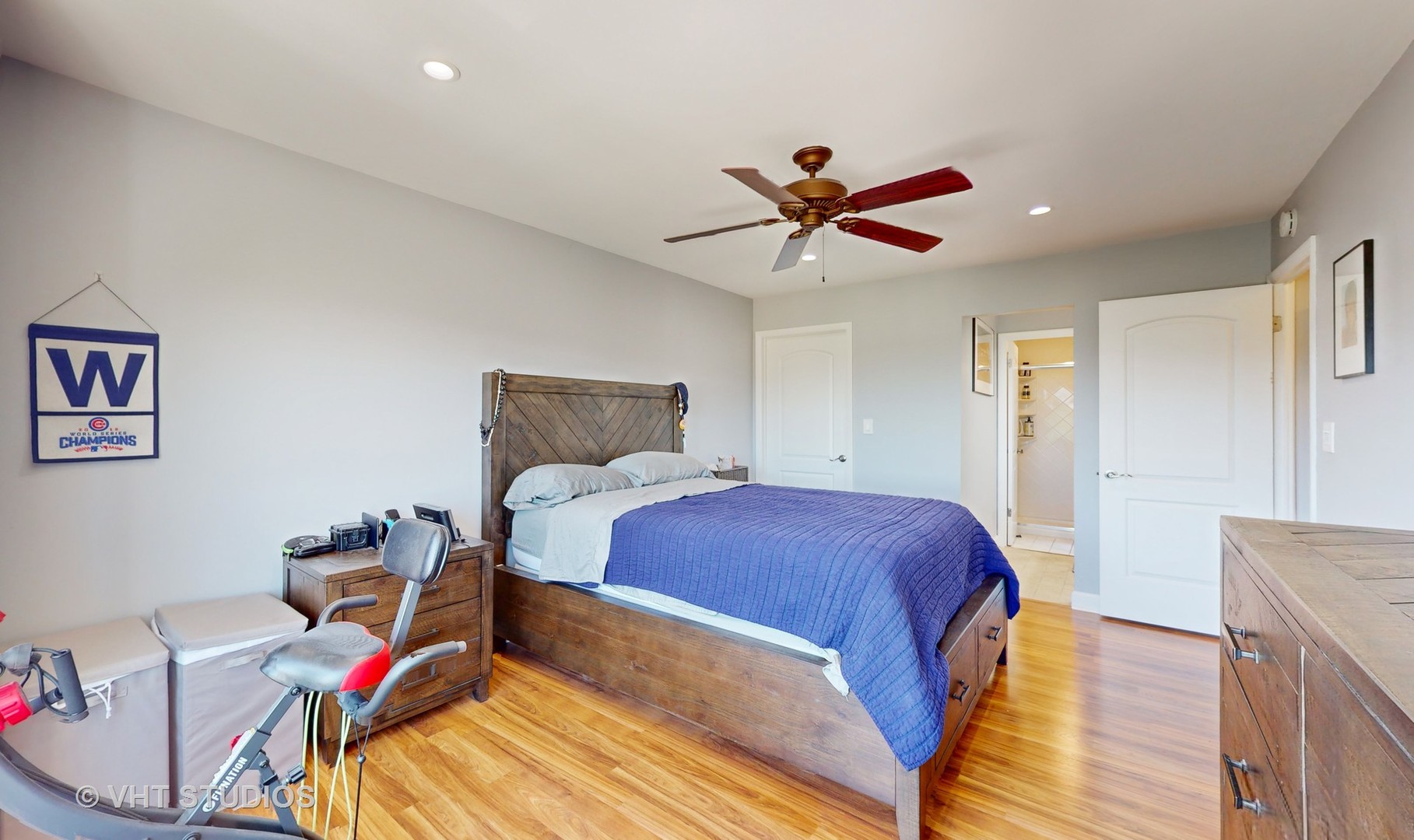 8630 Waukegan Road, Unit 519 Morton Grove, IL 60053 - Photo 17 of 26 a bedroom with a bed and a chandelier
