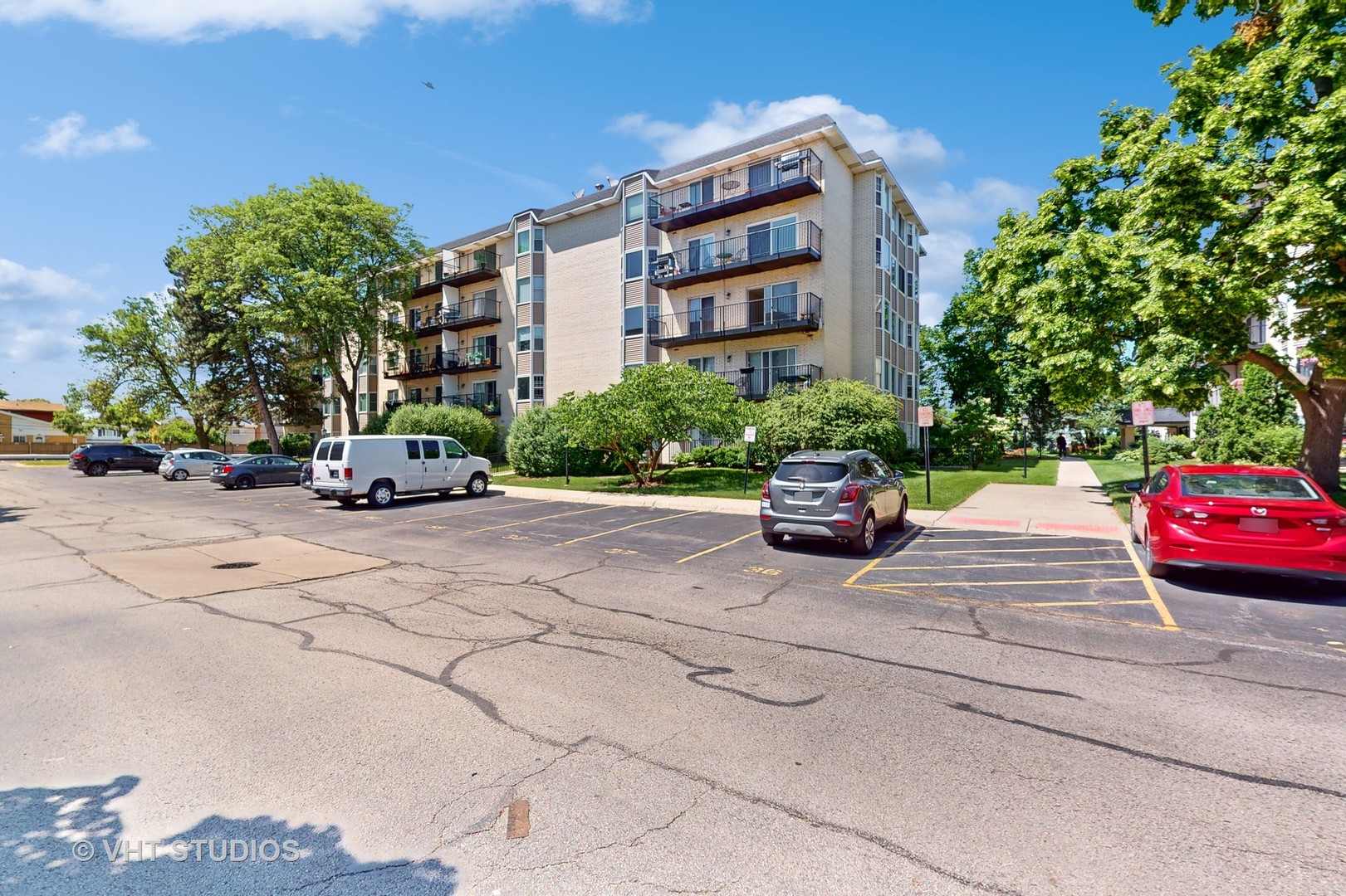 8630 Waukegan Road, Unit 519 Morton Grove, IL 60053 - Photo 25 of 26 a car parked in front of a building