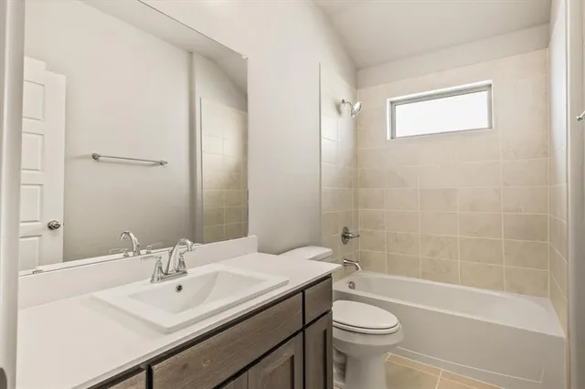 a view of a house with a yard and garage