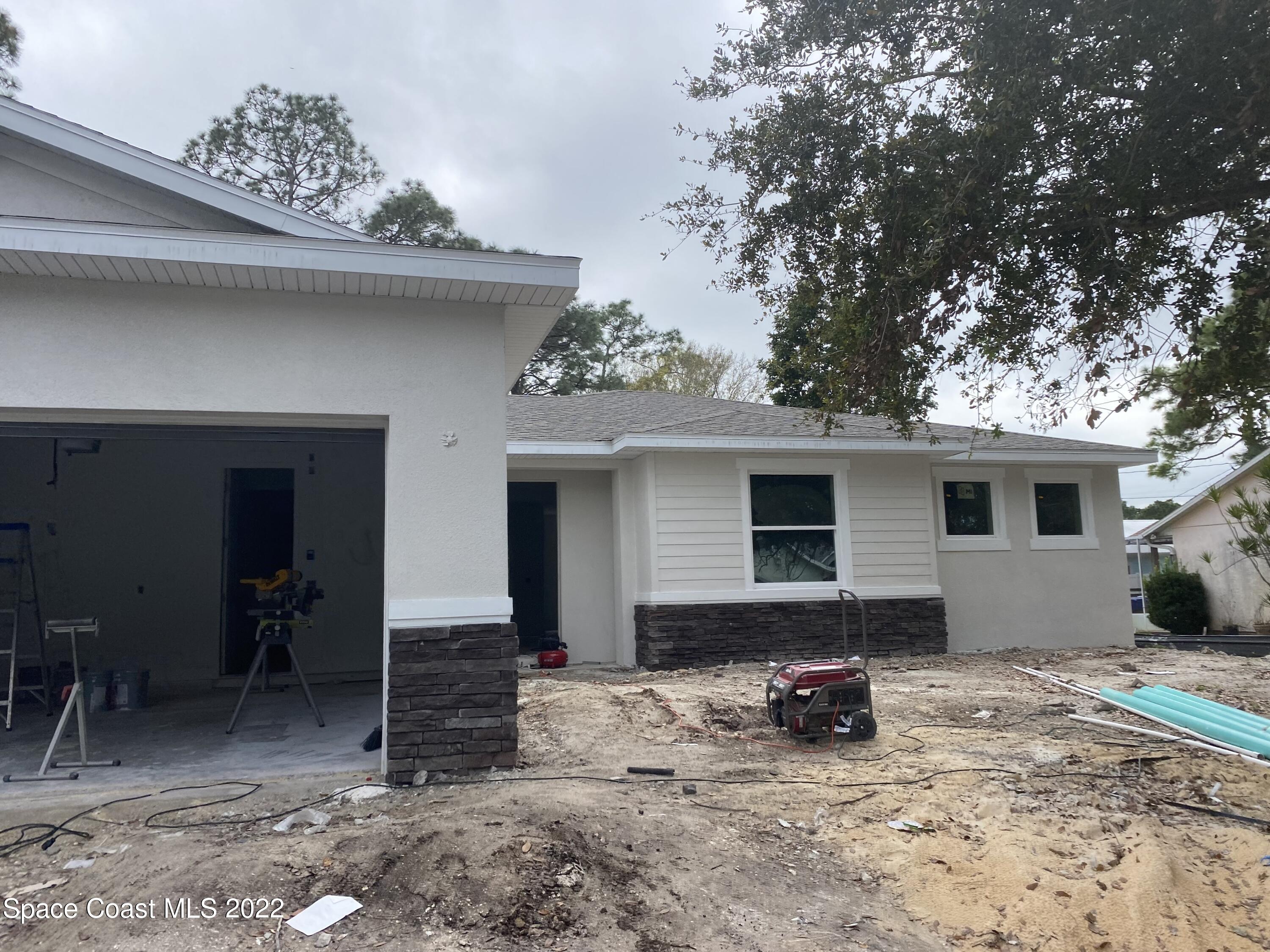 1376 Wing Road Southwest Palm Bay, FL 32908 - Photo 16 of 17 a view of a house with a patio