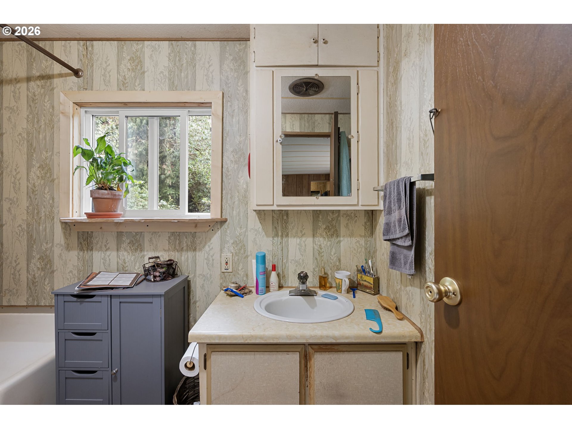 4826 Rhododendron Loop Florence, OR 97439 - Photo 27 of 41 a bathroom with a sink and a mirror