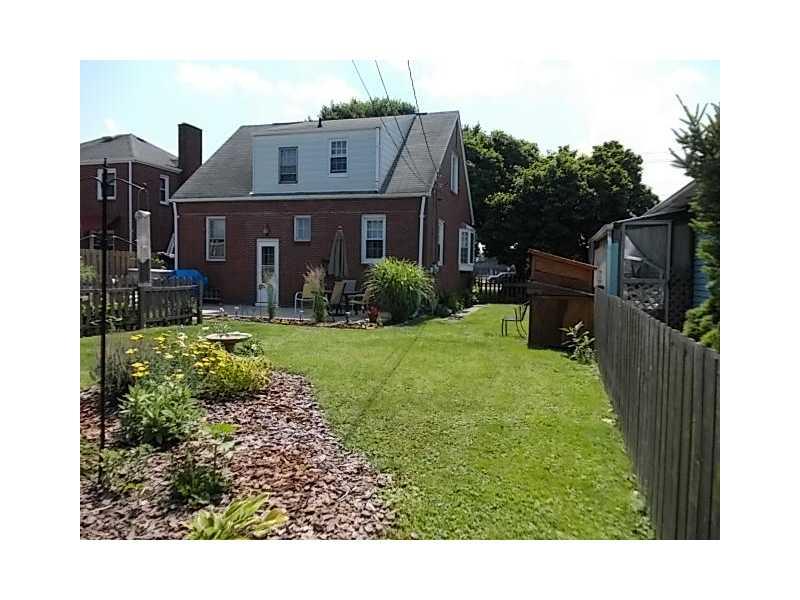 1903 Freeport Road Natrona Heights, PA 15065 - Photo 4 of 17 Exterior Back. a patio for grilling and gardens to view in the rear...
