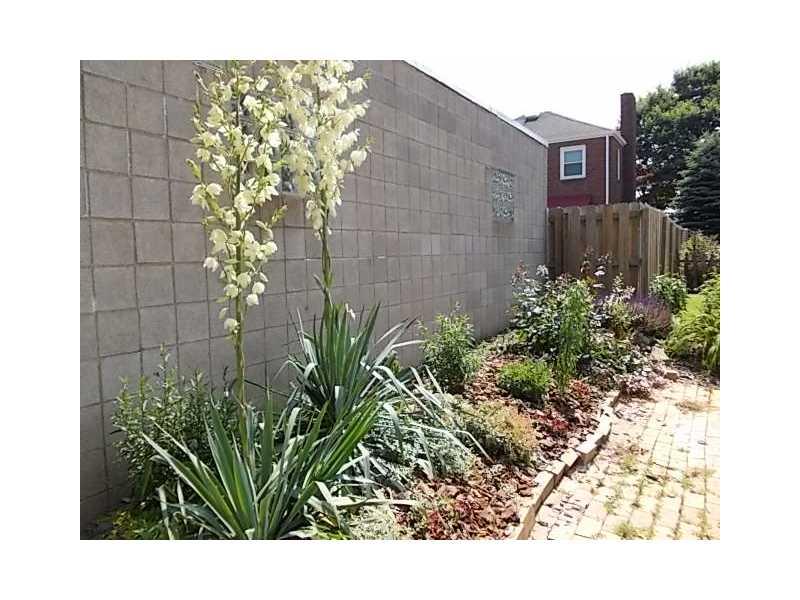 1903 Freeport Road Natrona Heights, PA 15065 - Photo 6 of 17 Exterior Back. parking pad with side garden...