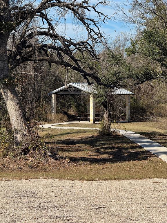 0 Bison Ridge Drive, Unit LOT 155 Stephenville, TX 76401 - Photo 11 of 13 a view of a house with a large tree