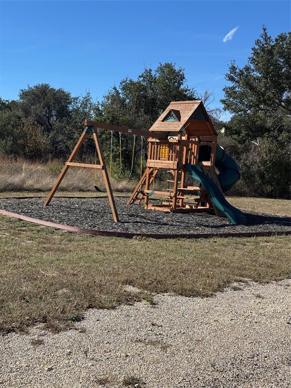 0 Bison Ridge Drive, Unit LOT 155 Stephenville, TX 76401 - Photo 10 of 13 a front view of a house with garden
