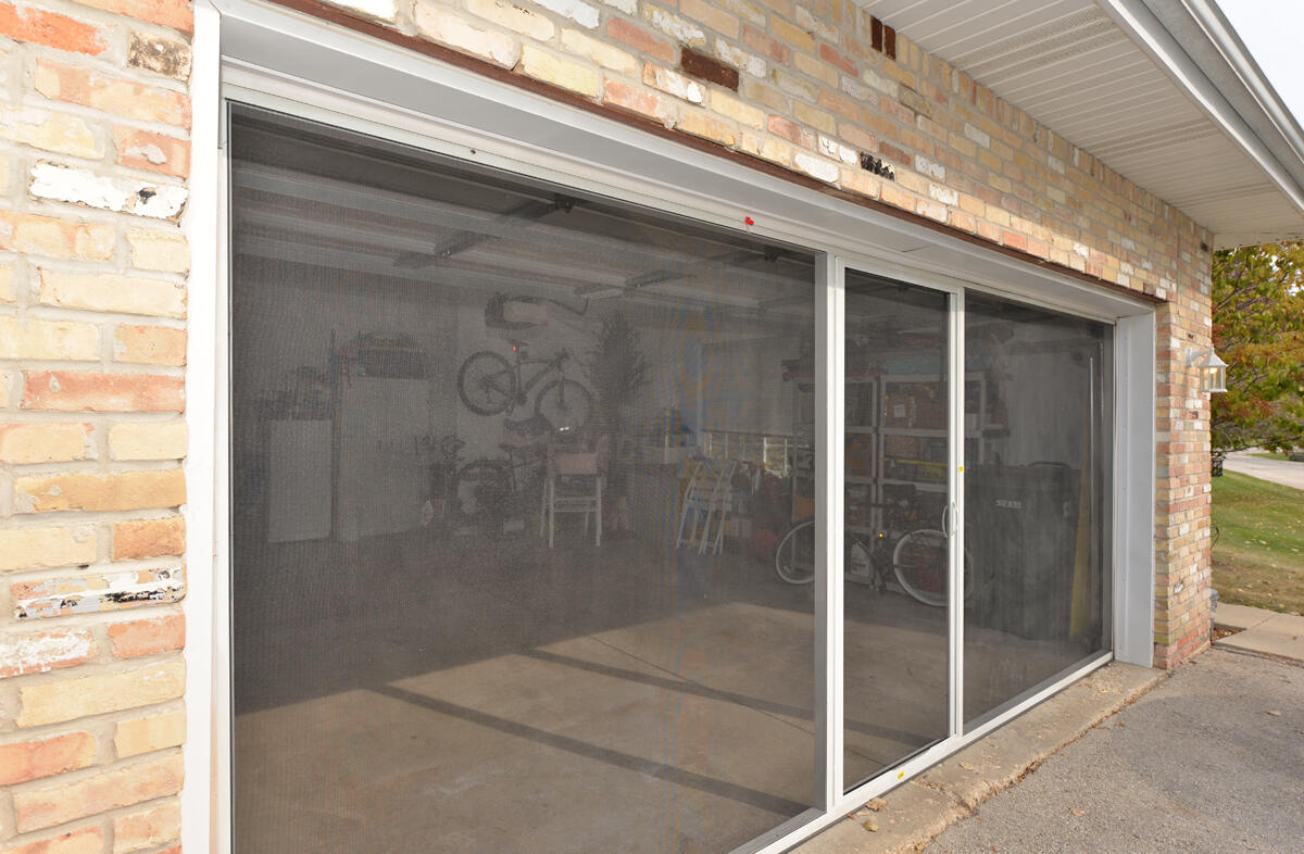4249 Taylor Harbor West, Unit 6 Mount Pleasant, WI 53403 - Photo 29 of 31 Retractable Garage Screen Door