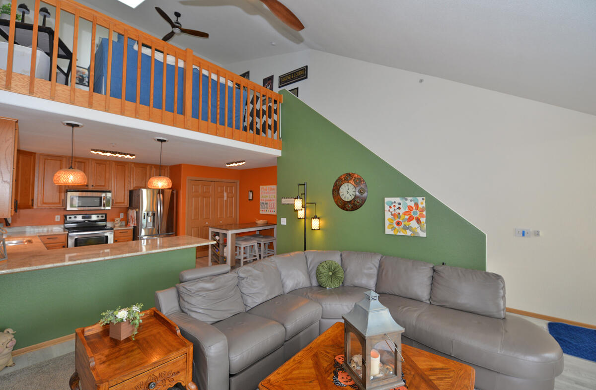 4249 Taylor Harbor West, Unit 6 Mount Pleasant, WI 53403 - Photo 6 of 31 Living Room/Stairs to Loft