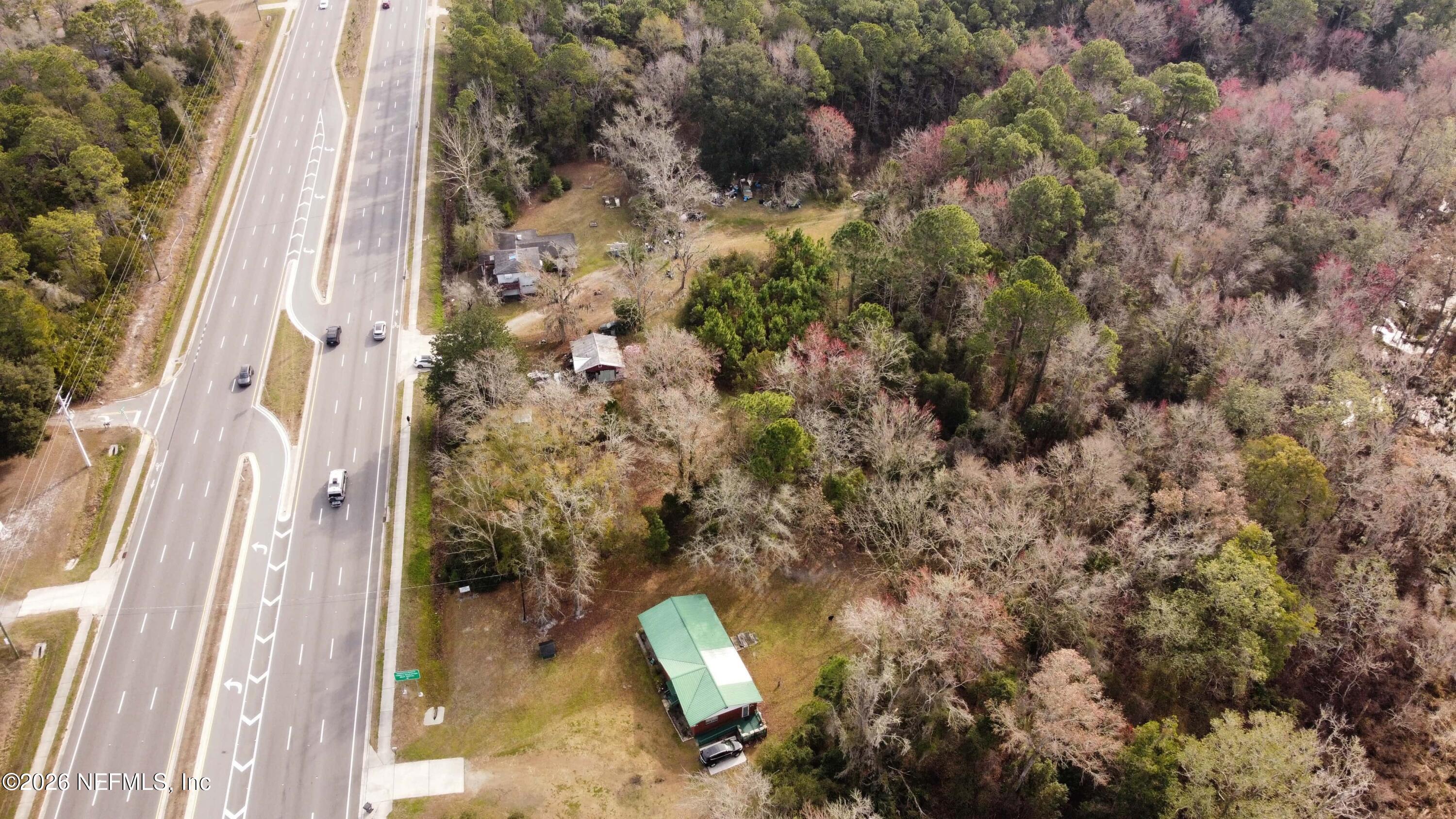 0 200th Road, Unit STATE Yulee, FL 32097 - Photo 15 of 17 a aerial view of a house with a yard and large tree