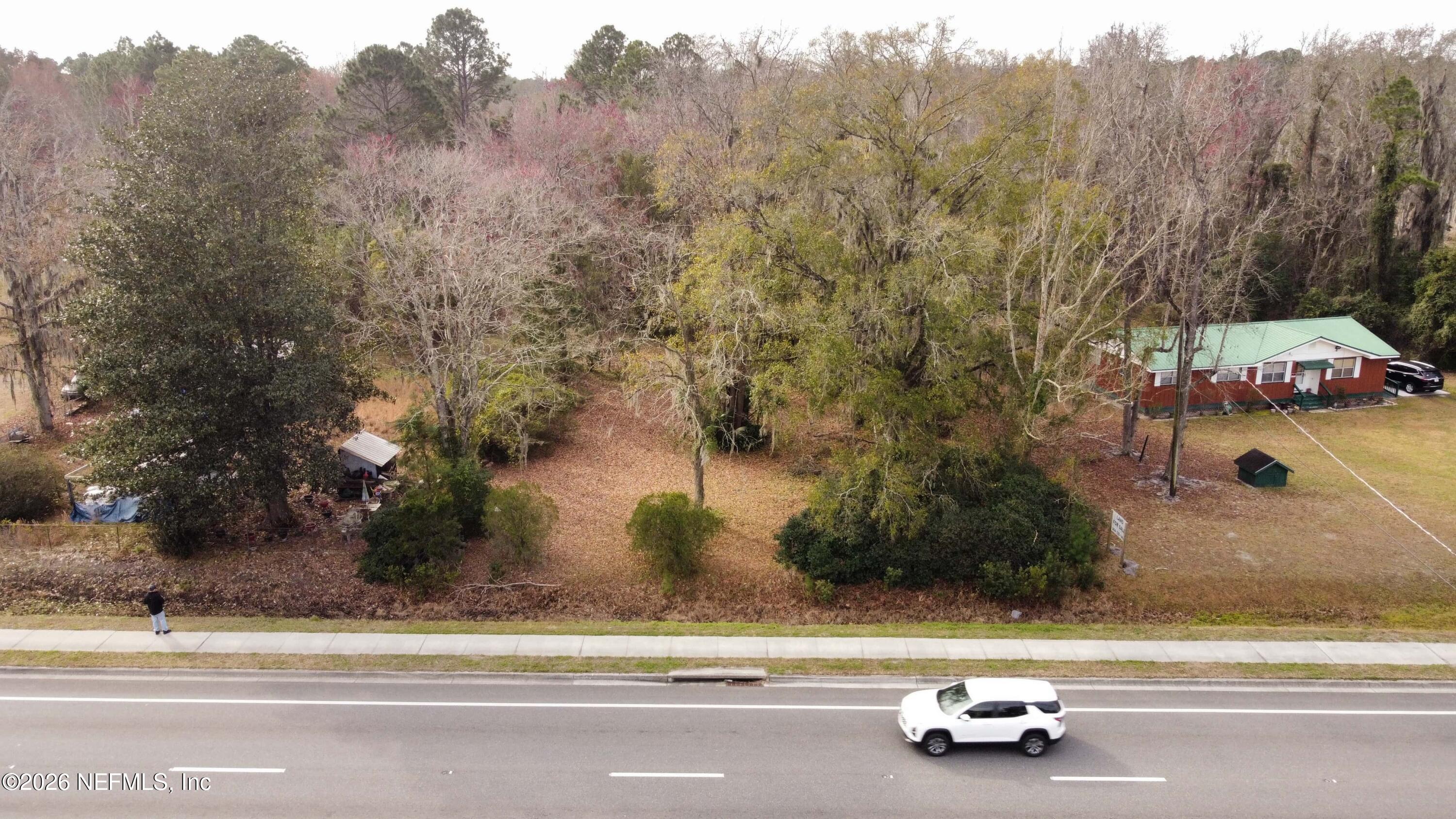 0 200th Road, Unit STATE Yulee, FL 32097 - Photo 8 of 17 a view of a street with a houses