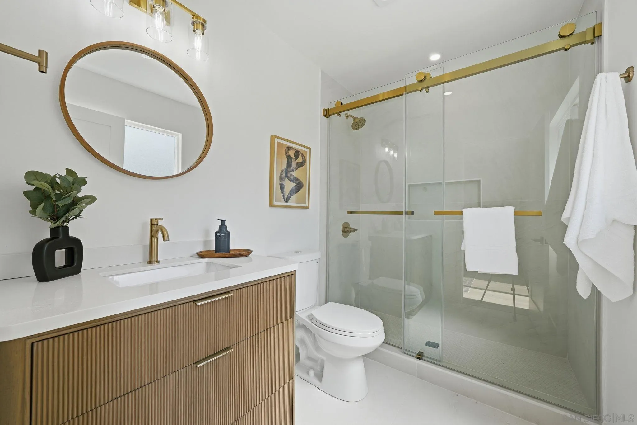 10440 Bosque Drive Lakeside, CA 92040 - Photo 42 of 47 a bathroom with a granite countertop sink mirror vanity and toilet
