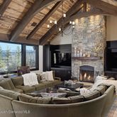 a living room with furniture fireplace and a flat screen tv