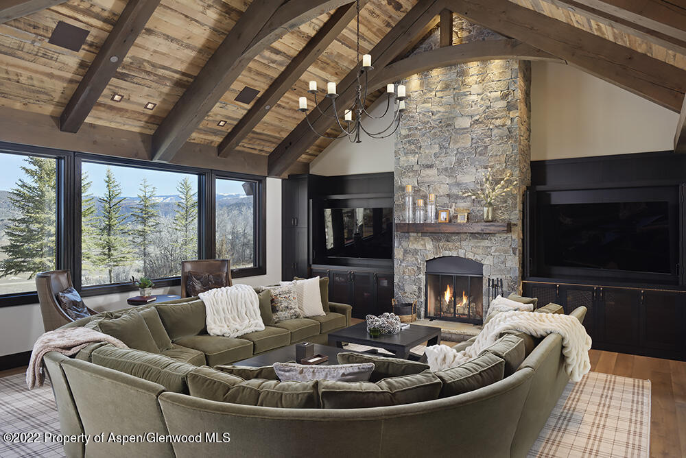 a living room with furniture fireplace and a flat screen tv