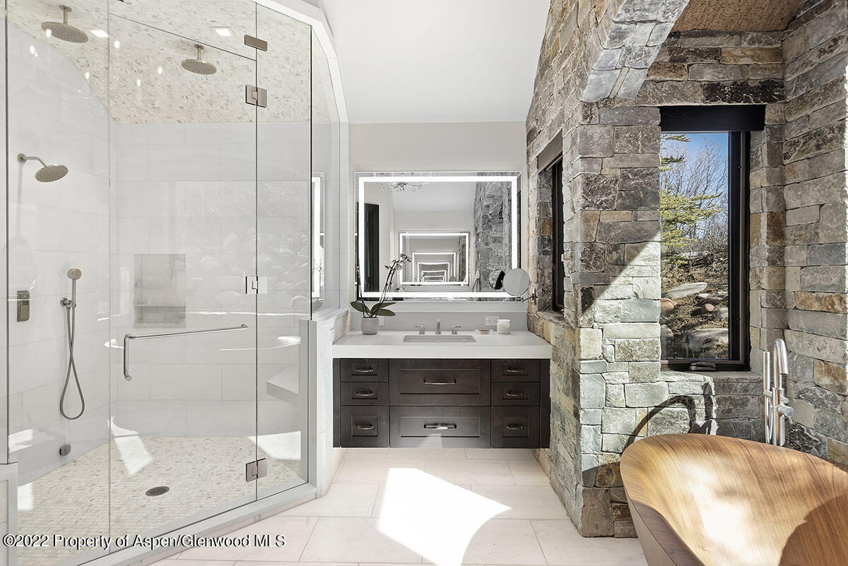 2322 Lazy O Road Snowmass, CO 81654 - Photo 14 of 42 a bathroom with a sink and a mirror