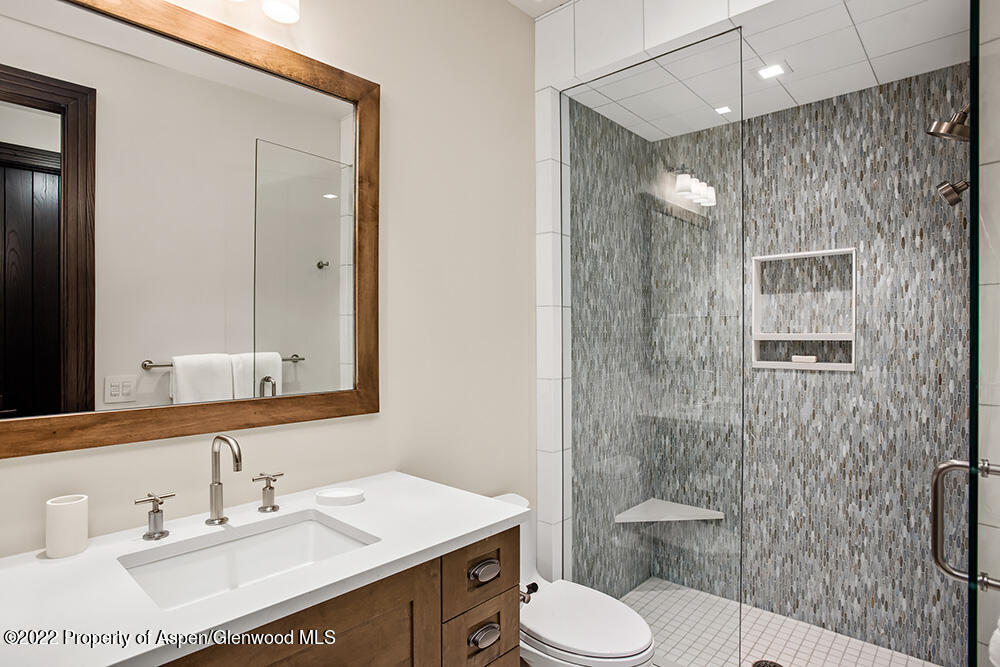 2322 Lazy O Road Snowmass, CO 81654 - Photo 18 of 42 a bathroom with a sink toilet and shower