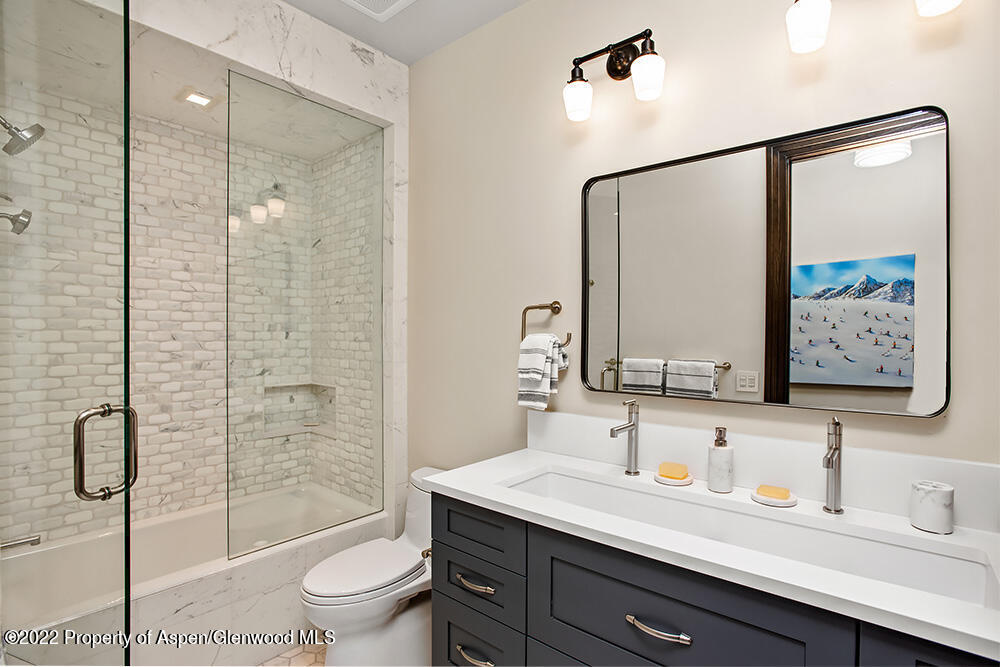 2322 Lazy O Road Snowmass, CO 81654 - Photo 20 of 42 a bathroom with a sink a toilet and shower