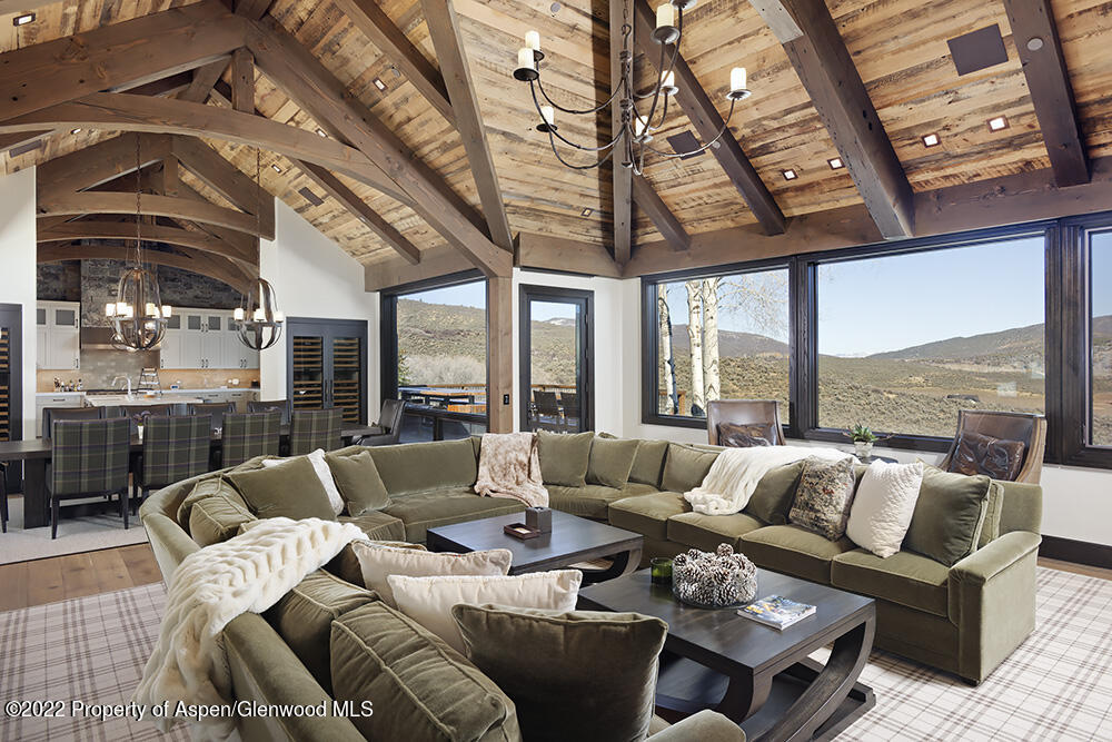 2322 Lazy O Road Snowmass, CO 81654 - Photo 2 of 42 a living room with furniture and a large window