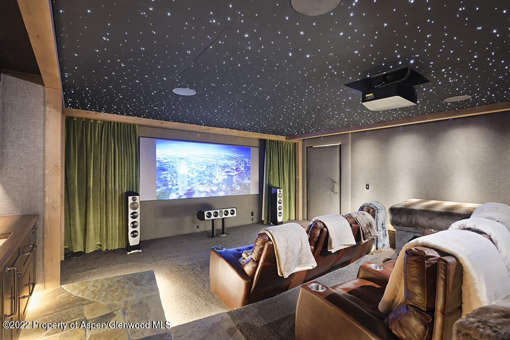 2322 Lazy O Road Snowmass, CO 81654 - Photo 29 of 42 a living room with furniture and a flat screen tv
