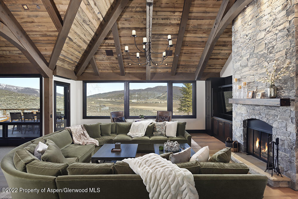 2322 Lazy O Road Snowmass, CO 81654 - Photo 3 of 42 a living room with furniture and a fireplace