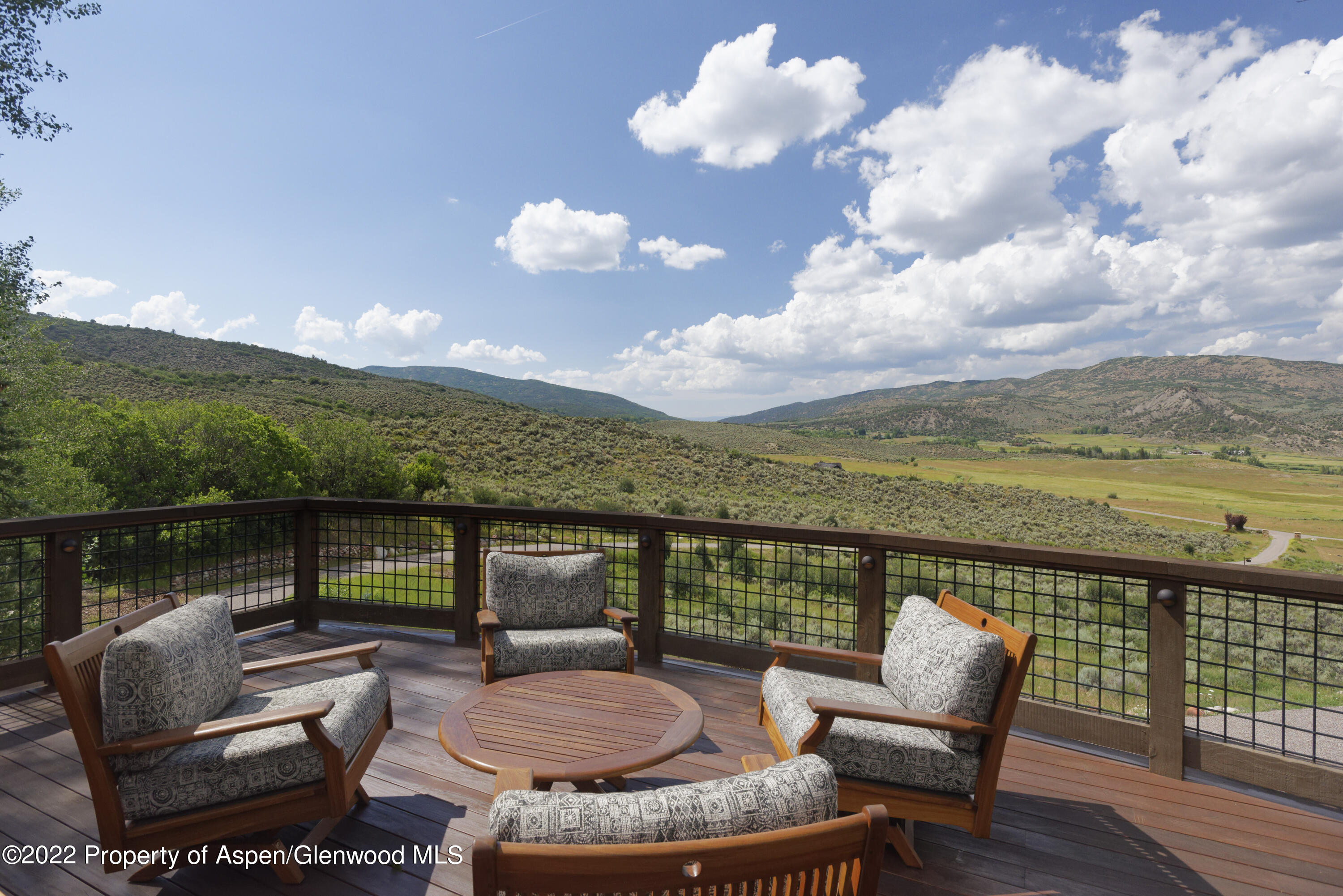 2322 Lazy O Road Snowmass, CO 81654 - Photo 32 of 42 a balcony with furniture and wooden floor