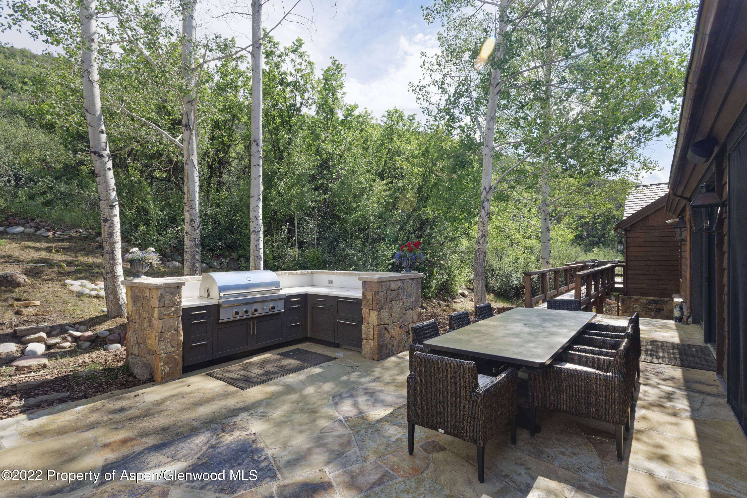 2322 Lazy O Road Snowmass, CO 81654 - Photo 37 of 42 a view of a dinning table and chairs in the patio