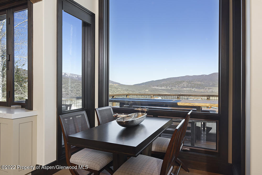 2322 Lazy O Road Snowmass, CO 81654 - Photo 6 of 42 a view of a balcony dining table and chairs